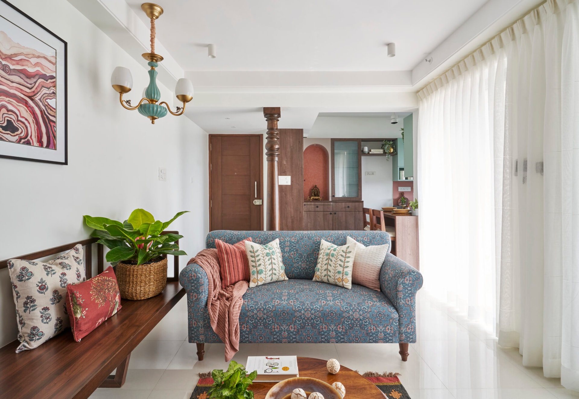 A hint of traditional elements with an earthy palette for this 730 Sqft Pune apartment, designed by  INI Studio — interior design by INI Design Studio in Pune