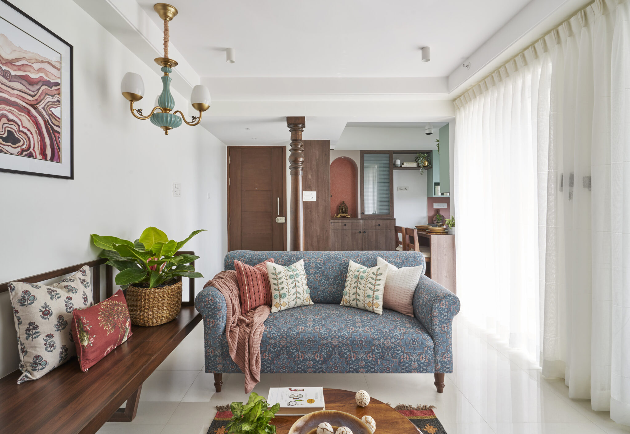 A hint of traditional elements with an earthy palette for this 730 Sqft Pune apartment, designed by  INI Studio — INI Design Studio, Pune
