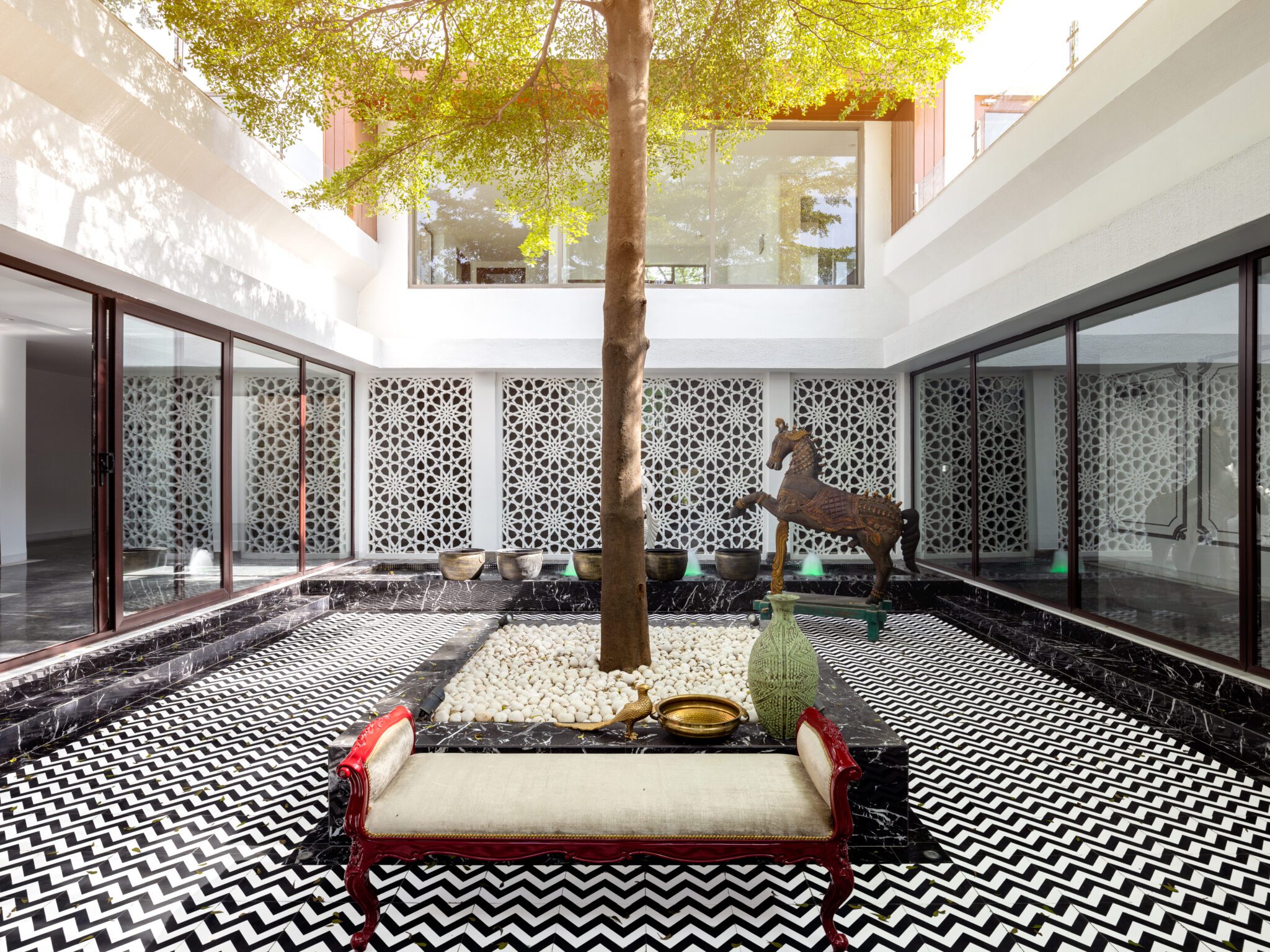 A harmonious confluence of styles and elements articulate grandeur in this luxurious abode by Altus Luxury Living — interior design by featured studio in Chattarpur, New Delhi